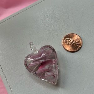 Pink and white glass heart charm.